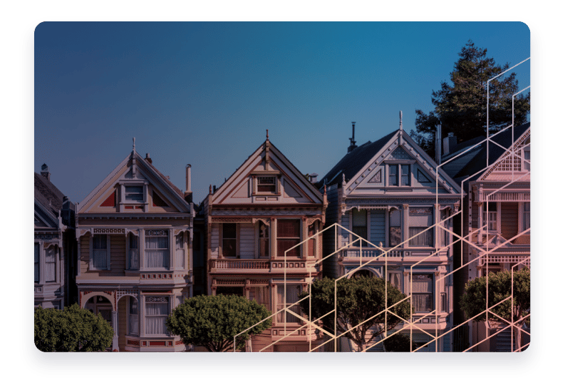 A row of Victorian style homes.